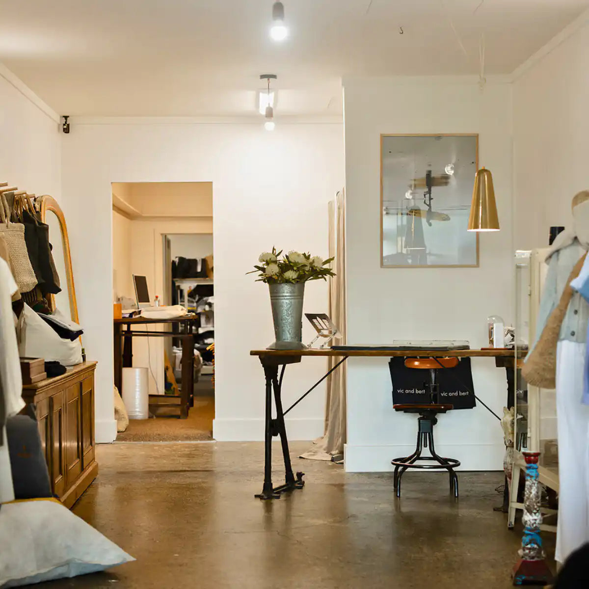 Vic and Bert clothing boutique interior with clothing displays and fitting area