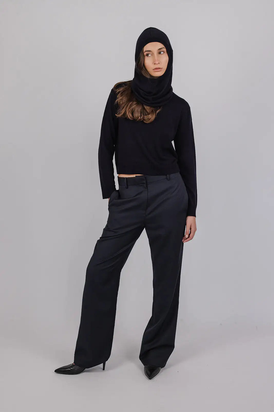 Model wearing a navy merino wool hood by Vic and Bert.